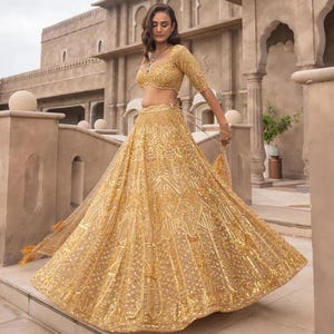 Lehenga Choli dorado con encaje y adornos para novias