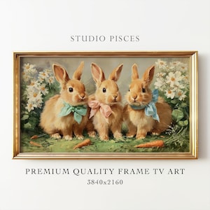 Könnte beinhalten: Gerahmtes Gemälde mit drei braunen Hasen mit pastellfarbenen Schleifen, umgeben von weißen Blumen und Karotten. Das Kunstwerk trägt die Aufschrift "STUDIO PISCES" und "PREMIUM QUALITY FRAME TV ART 3840x2160".
