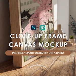 May include: A framed canvas mockup with a wooden frame, displaying a pink floral scene. The text "CLOSE-UP FRAME CANVAS MOCKUP" is visible. The mockup is on a wooden surface, with additional decorative items in the background.