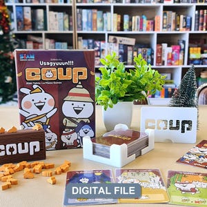 May include: A board game set featuring a box with the title Coup Usagyuuun, a brown wooden storage crate with the word Coup, a white card holder, a deck of cards, small wooden rabbit tokens, and three character cards labeled Digital File.