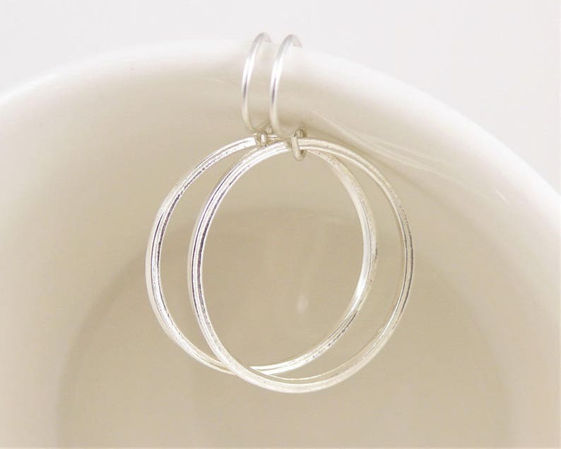 Textured hoop earrings in bright sterling silver your choice of two sizes