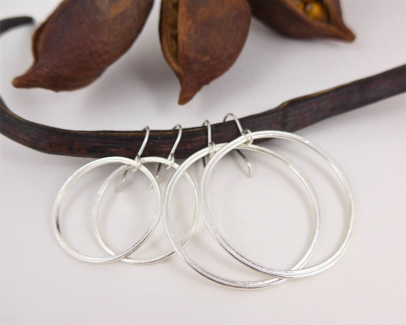 Textured hoop earrings in bright sterling silver your choice of two sizes