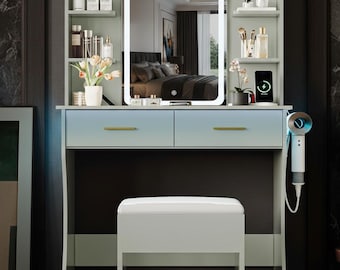 May include: A modern vanity set with a lighted mirror, two drawers, and a matching stool. The vanity is light blue and gray with gold-colored drawer pulls. Shelves on either side of the mirror hold beauty products and accessories. A white hair dryer is attached to the side.