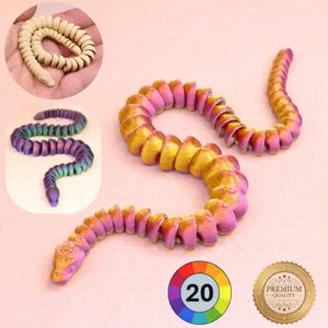 May include: A flexible, articulated snake toy in shades of gold, pink, and purple. The snake is coiled and has a segmented body. Additional images show a cream-coloured and a multicoloured snake. A colour wheel with the number 20 is also visible.