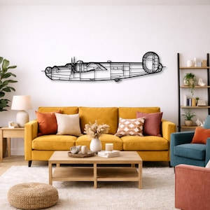 May include: A black metal wall art piece showing a vintage aeroplane. The artwork is mounted on a white wall above a yellow sofa. The aeroplane design features detailed outlines of the aircraft's structure, including the propellers and tail.