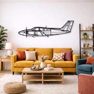 May include: A set of three ceramic mugs with a speckled, matte finish. The mugs are in shades of cream, light gray, and dark gray. Each mug has a simple, minimalist design and a rounded handle.