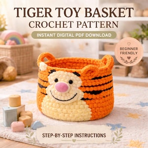 May include: An orange and cream-colored crochet toy basket with a tiger face design. The basket has black stripes and a pink nose. The text on the image reads "TIGER TOY BASKET CROCHET PATTERN" and "STEP-BY-STEP INSTRUCTIONS".