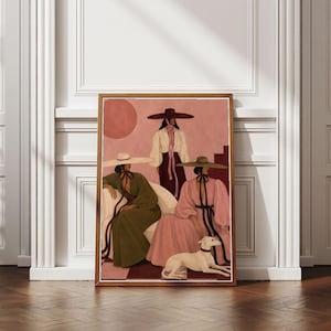 May include: A framed art print featuring three figures wearing wide-brimmed hats and long-sleeved garments in shades of olive green, white, and pink. A small white dog sits at the feet of the figures against a dusty pink background with a circle.