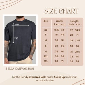 May include: A size chart for a Bella Canvas 3001 t-shirt, with measurements in inches and centimeters. The chart includes sizes XS to 3XL, with width ranging from 16.5 to 28 inches and length from 27 to 33 inches. The text advises ordering two sizes up for an oversized look.