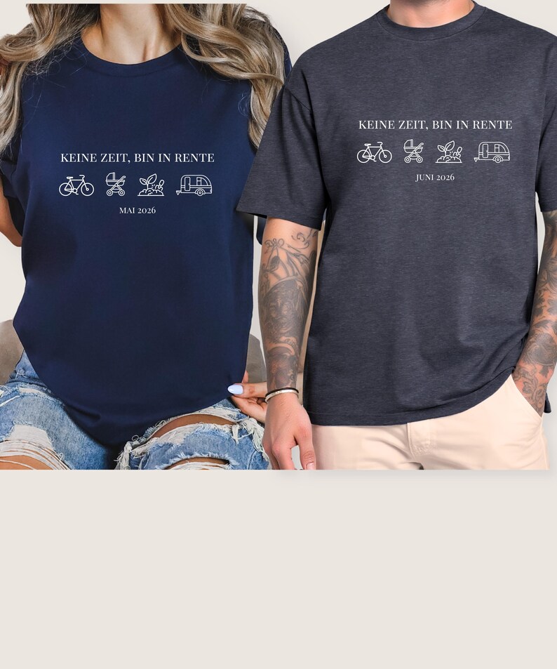 May include: Two dark-colored t-shirts with white text and graphics. The text reads "KEINE ZEIT, BIN IN RENTE" above a bicycle, stroller, plant, and camper graphic. One shirt says "MAI 2026" and the other says "JUNI 2026".