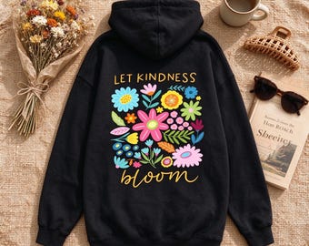 May include: A black hooded sweatshirt featuring a graphic on the back with the text "LET KINDNESS bloom" in yellow lettering, surrounded by a colorful illustration of various flowers in shades of pink, blue, green, orange, and yellow.
