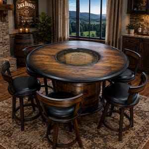 May include: A round wooden table with a dark finish and a central glass inlay featuring the Jack Daniel's logo, supported by a barrel base. The table is surrounded by four wooden swivel bar stools with black padded seats and curved backrests.