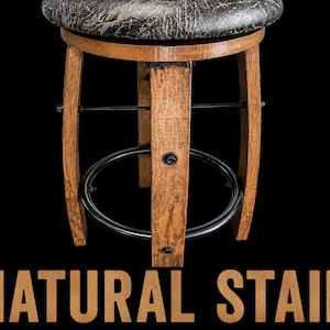May include: A swivel bar stool featuring a round, textured black seat atop a curved, light brown wooden base with a circular black metal footrest. The base is constructed from vertical wooden staves. The text NATURAL STAIN appears below.
