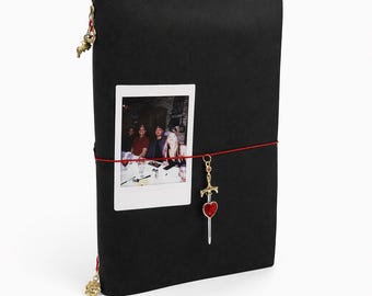 Black Leather Travel Journal – Sword Charm, Gold Accents, Red Elastic Closure