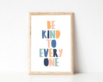 May include: A framed print with the text "BE KIND TO EVERY ONE" in colorful, block letters. The letters are in shades of blue, green, orange, and pink.