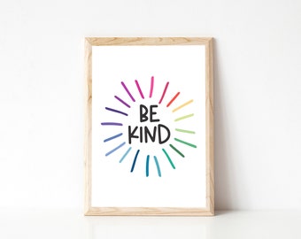 May include: A framed print with a white background and a colorful rainbow circle with the text "BE KIND" in black.