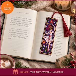 May include: A rectangular cross-stitch bookmark featuring a ballerina in a white dress on a dark purple background, accented with small holiday motifs like gifts and trees. The bookmark includes a deep red tassel attached to the top edge.