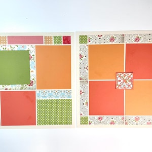 May include: Two scrapbook pages with a variety of colorful patterned paper squares. The pages feature orange, red, green, and floral designs. One page has a green square for a photo. The other has a decorative square in the center.