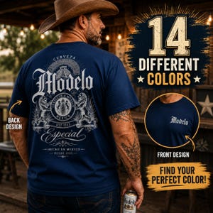May include: A navy blue t-shirt featuring a large white graphic on the back with the text Modelo Especial, a pyramid, and two lions. The front of the shirt displays the word Modelo in white text. The image includes text stating 14 DIFFERENT COLORS.