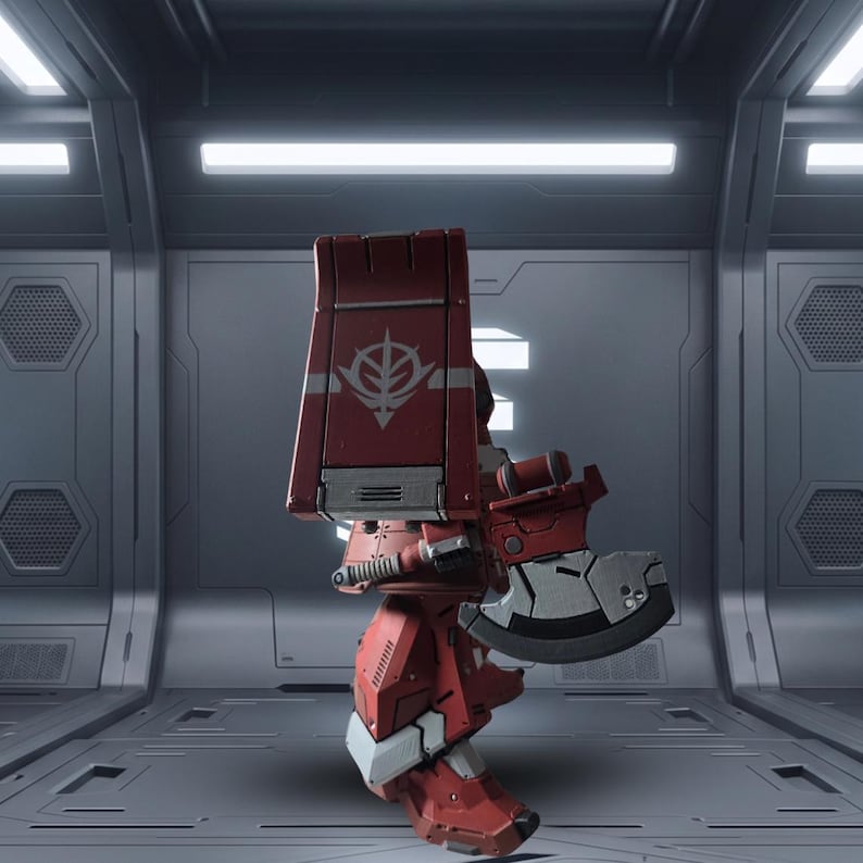 May include: A red robotic action figure featuring a large rectangular shoulder shield with a white emblem, a metallic gray and red handheld axe, and articulated armor plating. The figure stands in a profile view with mechanical detailing throughout.