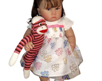 Life like large baby doll and sock monkey.