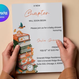 May include: A baby shower invitation with the text "A New Chapter Will Soon Begin". The invitation features a stack of books with autumn leaves and a clock, and a bird. The invitation is held by a person.