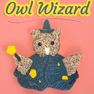 May include: A handmade crochet owl wizard doll with a blue cape, hat, and a yellow star-shaped wand. The owl has a speckled gray and white body, black eyes, and a white beak. The text "Owl Wizard" is above the owl.