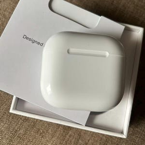 May include: A set of three ceramic nesting bowls in shades of blue, green, and white. The bowls feature a speckled glaze and a simple, modern design. The largest bowl measures approximately 6 inches in diameter.