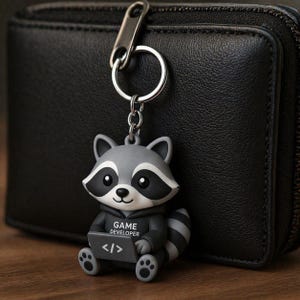 Brelok z figurką szopa pracza, ręcznie malowany, drukowany w 3D dodatek dla gracza, zawieszka z jedną postacią na biurko lub do torby