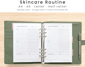 May include: A sage green six-ring binder containing two open pages of a Skincare Routine planner. The white pages feature black text, checkboxes for days of the week, and sections for day, night, skin condition, and notes. A silver pen is attached.