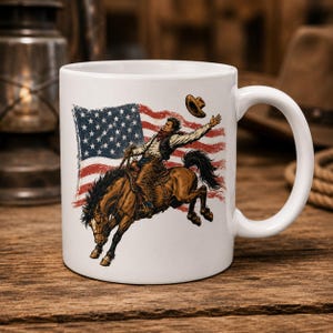 White ceramic mug mockup displaying vintage cowboy riding horse with western American flag PNG design