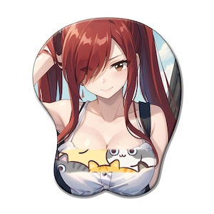 May include: Erza Scarlet anime mousepad with a wrist rest. The mousepad features a smiling anime character with red hair and a white top with cat graphics. The background shows a blue sky and a building.