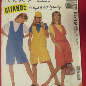 May include: A sewing pattern for a sleeveless jumpsuit with a V-neckline. The pattern is for sizes large and extra large. The pattern is from McCall's Gitano line and is called "today's spirited family".