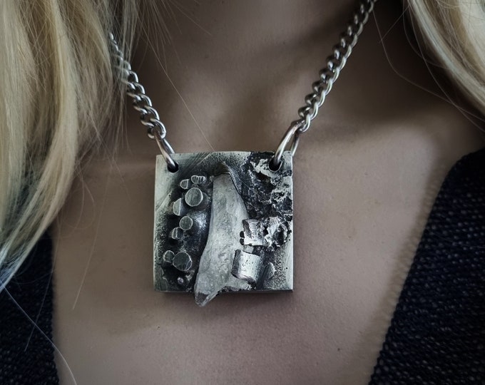 Emergent | Brutalist necklace, textured silver pewter square set with a large chunk of clear recycled glass