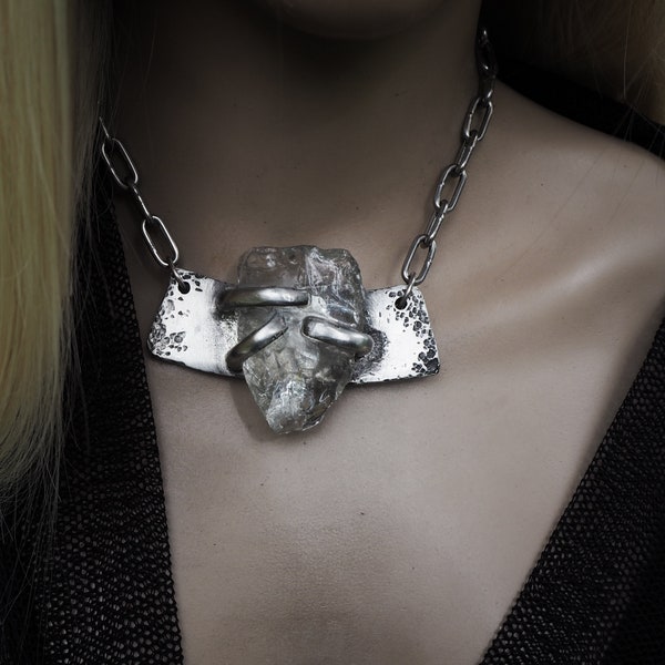 Brutalist recycled glass necklace | textured silver metal set with a large chunk of clear glass