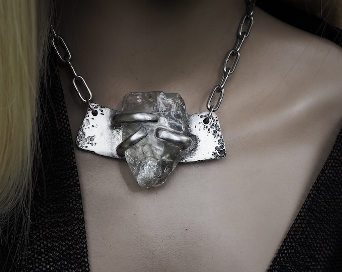 Brutalist recycled glass necklace | textured silver metal set with a large chunk of clear glass