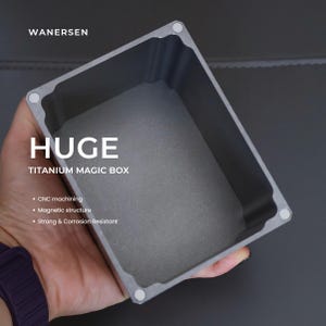 May include: A rectangular gray titanium box with a hollow interior, featuring four small circular magnets at the corners. The text WANERSEN, HUGE TITANIUM MAGIC BOX, CNC machining, Magnetic structure, and Strong & Corrosion Resistant are visible.