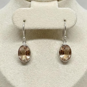 Soft peach gemstone earrings handcrafted in sterling silver, lightweight oval dangle design ideal for modern women who love minimalist jewelry and romantic wedding accessories.