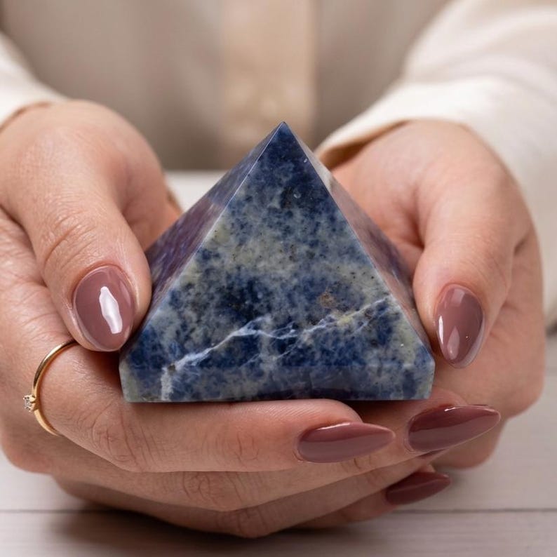 Decorative sodalite pyramid crystal with rich blue tones and white streaks, perfect for chakra alignment and positive energy.