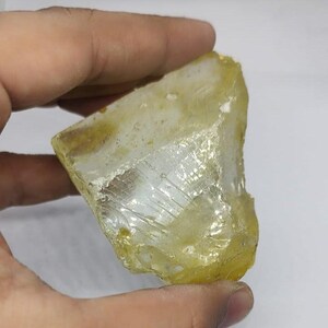 Lemon quartz healing crystal rough stone with bright yellow hue, excellent for energy work, reiki sessions, jewelry making supplies and home decor display.