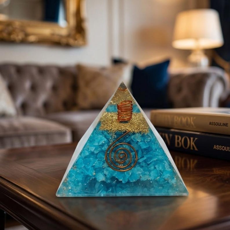 Resin amazonite orgone pyramid generator placed on desk for EMF protection, meditation focus, and positive energy flow in home or office.