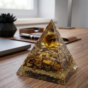 Tiger eye healing crystal pyramid known for prosperity, abundance, and protection, perfect for office desk decor and business success energy.