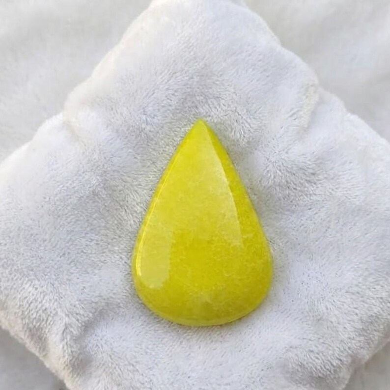 Genuine yellow sapphire pear shape gemstone displayed as loose teardrop stone with radiant sparkle, suitable for luxury engagement rings and handcrafted jewelry.