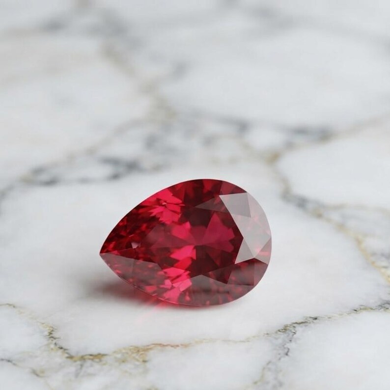 Deep crimson natural ruby teardrop gemstone with brilliant shine, loose precious stone for custom jewelry, anniversary gift or July birthstone ring