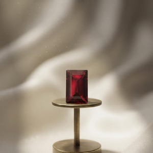 Natural precious ruby rectangular cut gemstone with vibrant red hue and elegant sparkle, perfect for July birthstone gift and fine jewelry crafting.