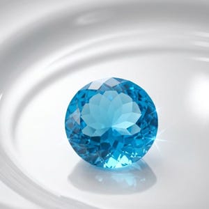 Faceted round Swiss Blue Topaz gemstone with deep sky blue brilliance, loose gem ideal for jewelry designers creating engagement rings and statement pieces.
