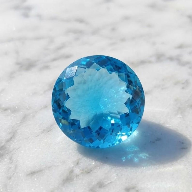 Genuine Swiss Blue Topaz round brilliant crystal, loose gemstone with elegant sparkle for bridal engagement ring centerpiece and December birthstone gift.