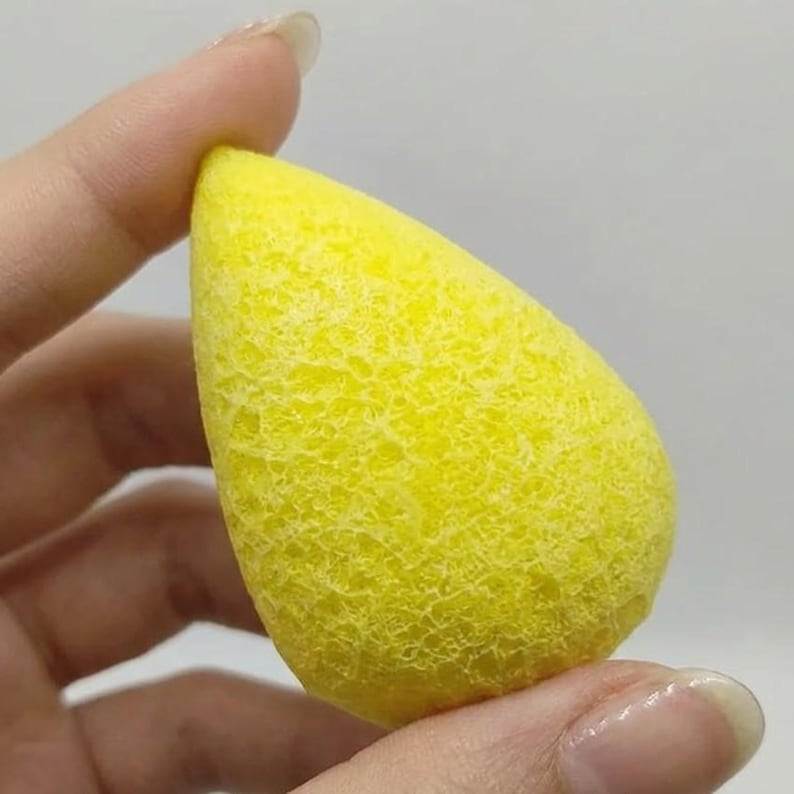 Pear shaped yellow sapphire rough gemstone in vibrant lemon yellow color, natural raw Jupiter stone for jyotish remedies, healing energy practices, and feng shui wealth decor.