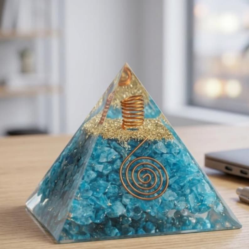 Amazonite crystal orgonite pyramid featuring turquoise blue stones and copper spiral coil, ideal for EMF shielding, chakra balancing, meditation practice, and Feng Shui energy enhancement.