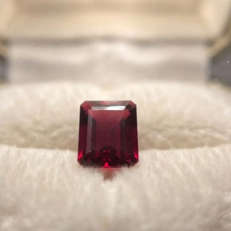 Genuine natural ruby cabochon loose stone with smooth dome top and vibrant red tone, ideal for engagement ring or statement pendant